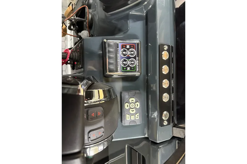 Slide: The Image of Control panel of 2021 XO Boats DFNDR 9 with buttons and display. - 46