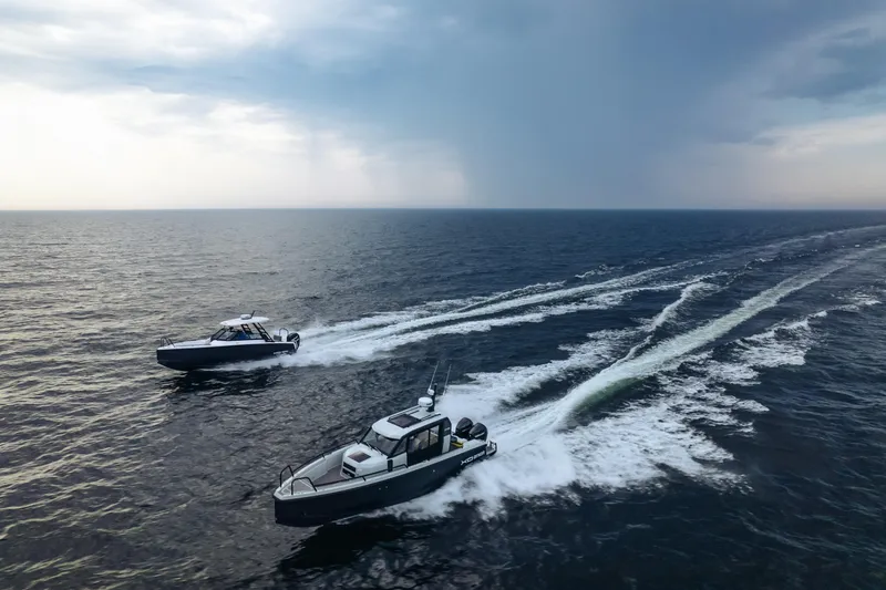 Slide: The Image of 2021 XO Boats DFNDR9 interior with dual seats and steering console. - 8