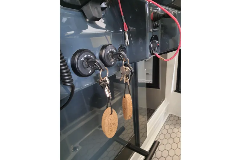 Slide: The Image of 2021 XO Boats DFNDR9 interior bathroom with toilet and sink. - 20