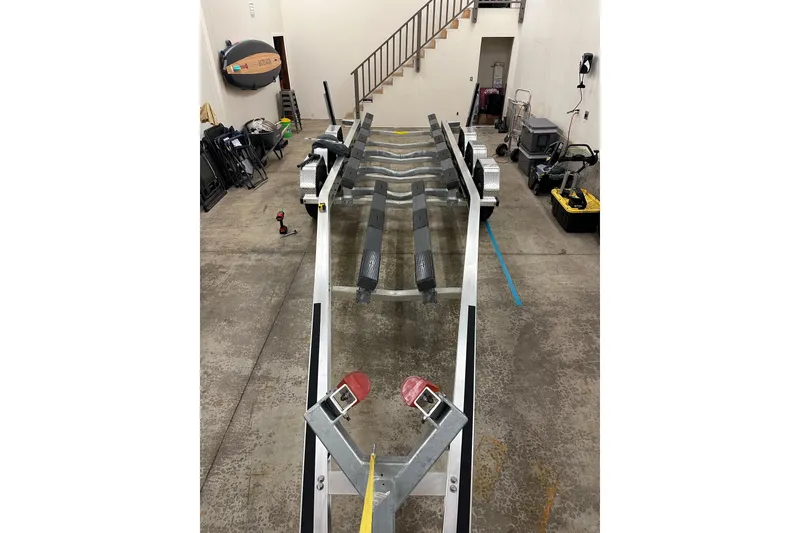 Slide: The Image of 2021 XO Boats DFNDR 9 interior seats with yellow and gray design. - 37