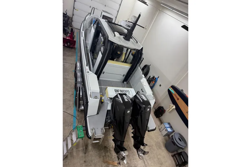 Slide: The Image of Interior of 2021 XO Boats DFNDR 9, featuring sleek cabinetry and modern design elements. - 42