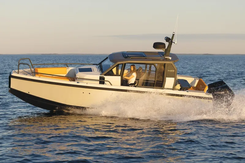 Slide: The Image of Dashboard display of a 2021 XO Boats DFNDR 9, showing engine metrics and navigation data. - 44