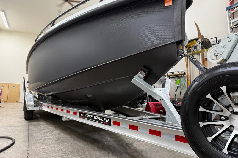 Slide: The Image of 2021 XO Boats DFNDR 9 on Tuff Trailer in garage setting. - 48