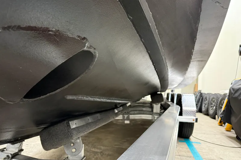 Slide: The Image of 2021 XO Boats DFNDR 9 hull on trailer, showcasing sleek design and craftsmanship. - 50