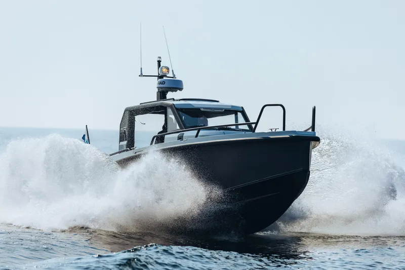 Slide: The Image of Interior of 2021 XO Boats DFNDR9, featuring two seats and modern design. - 7