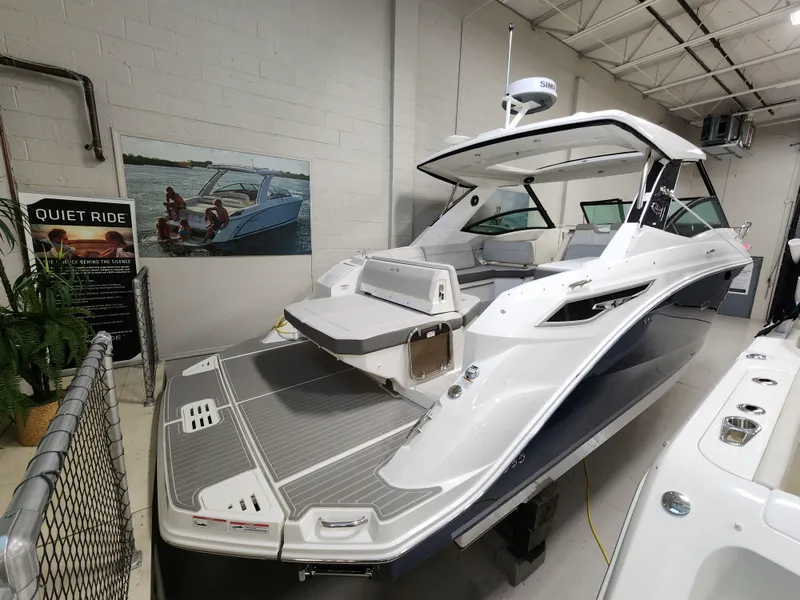 Slide: The Image of 2023 Sea Ray Sundancer 320 in a showroom. - 1