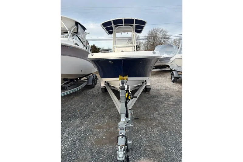 Slide: The Image of 2021 Robalo R200 Center Console boat on trailer, parked outdoors. - 4