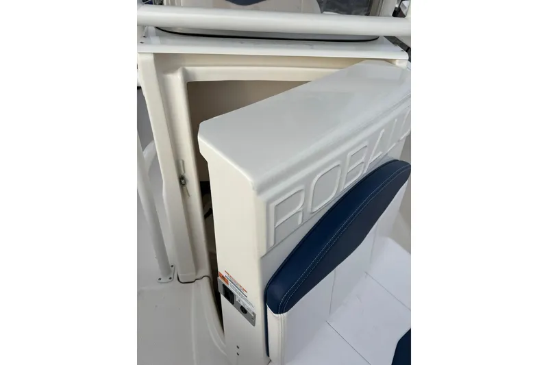 Slide: The Image of 2021 Robalo R200 Center Console boat interior with storage compartment. - 7