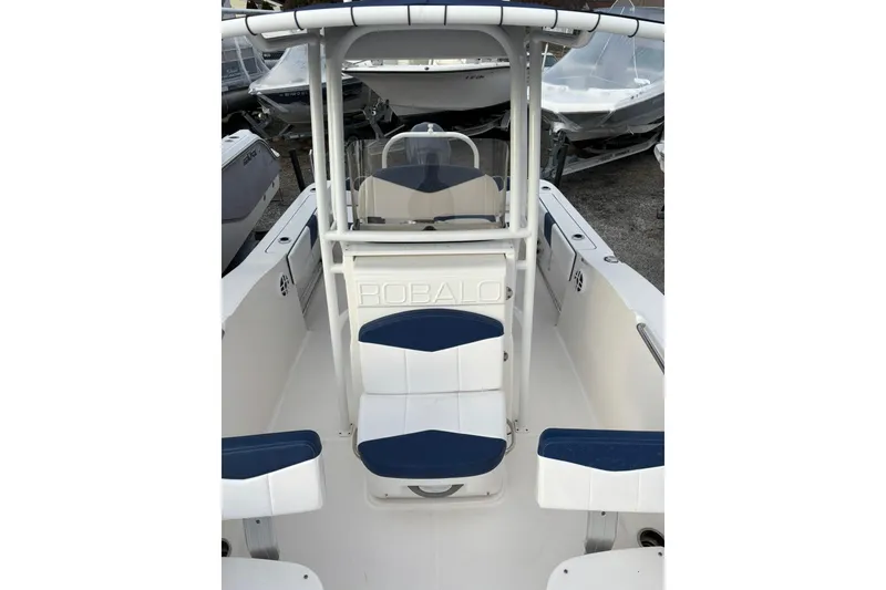 Slide: The Image of 2021 Robalo R200 Center Console boat interior with blue and white seating. - 9