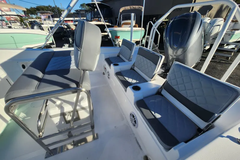 Slide: The Image of 2026 NauticStar 211 Hybrid boat interior with gray seating and modern design. - 3