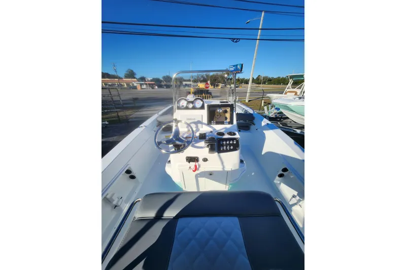 Slide: The Image of 2026 NauticStar 211 Hybrid boat interior with steering console and seating. - 4