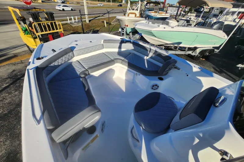 Slide: The Image of 2026 NauticStar 211 Hybrid boat interior with gray seating and modern design. - 9