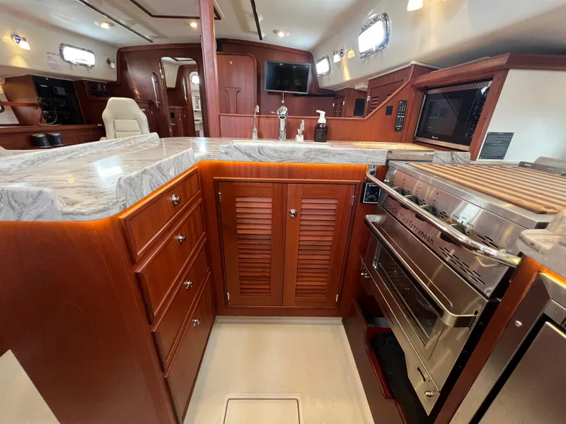 Slide: The Image of Interior view of Island Packet 439 yacht kitchen, 2023 model. - 17