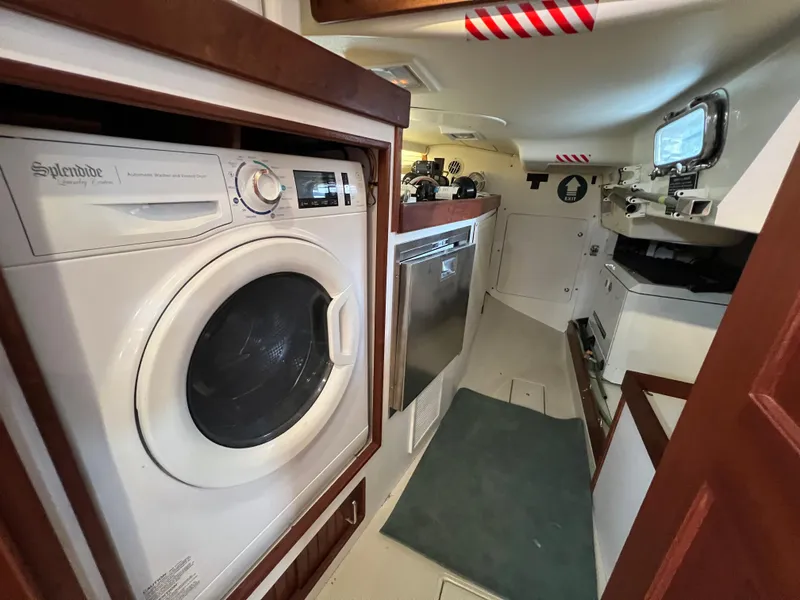 Slide: The Image of Interior of 2023 Island Packet 439 yacht with washer and appliances. - 30