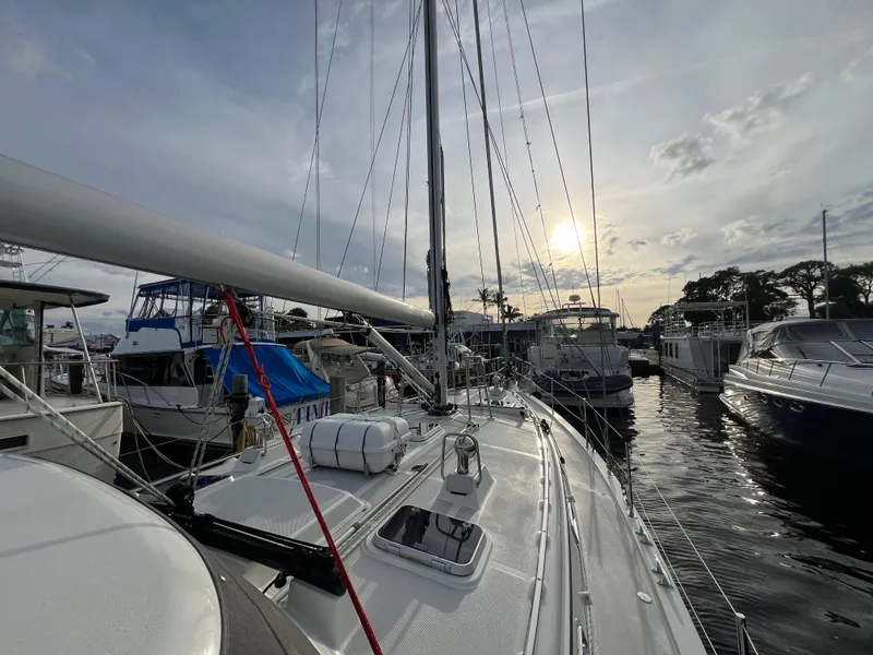 Slide: The Image of 2023 Island Packet 439 sailboat docked at sunset. - 4