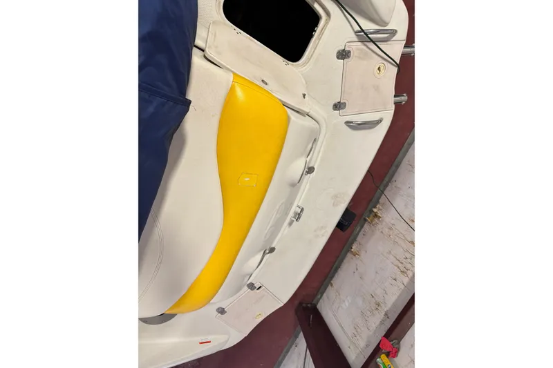 Slide: The Image of 2009 Tahoe 215xi I/O boat interior with yellow and white seating. - 14