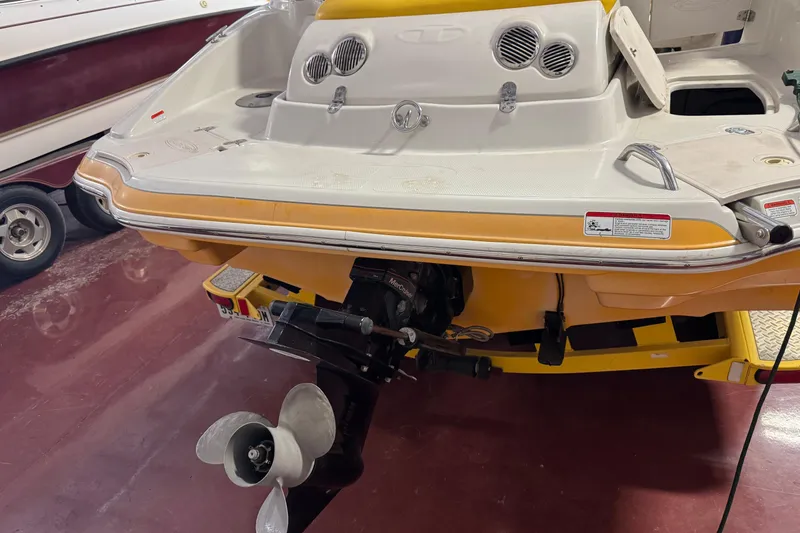 Slide: The Image of 2009 Tahoe 215xi I/O boat stern with propeller in a showroom. - 17