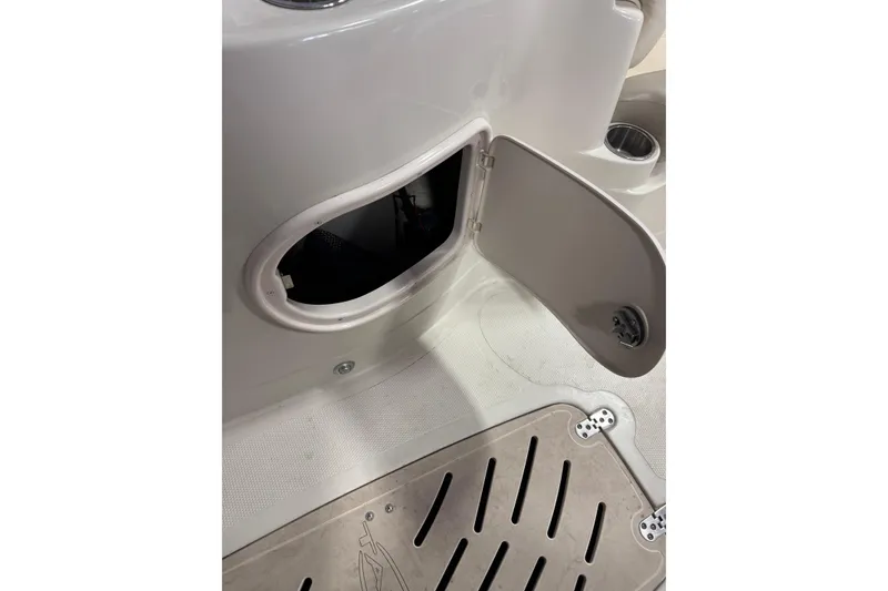 Slide: The Image of Open storage compartment on 2009 Tahoe 215xi I/O boat deck. - 5