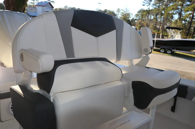 Slide: The Image of 2026 Robalo 246 Cayman boat seat with sleek white and black design. - 13