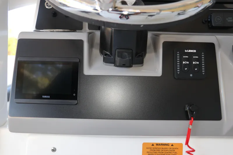 Slide: The Image of Control panel of 2026 Robalo 246 Cayman boat with Yamaha display and Lenco controls. - 18