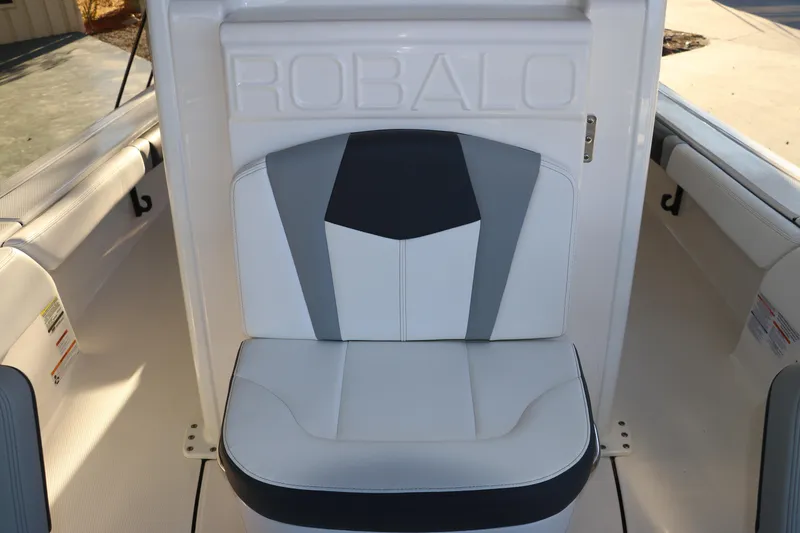 Slide: The Image of 2026 Robalo 246 Cayman boat seat with stylish white and gray upholstery. - 22