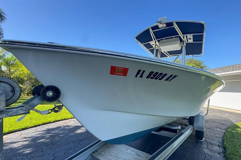 Slide: The Image of 1972 Cuda Craft Open Fisherman boat on trailer, sunny day, Florida registration visible. - 10