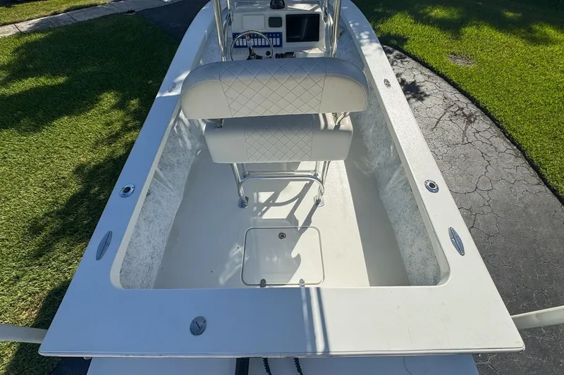 Slide: The Image of 1972 Cuda Craft Open Fisherman boat interior with seating and console, parked on driveway. - 11