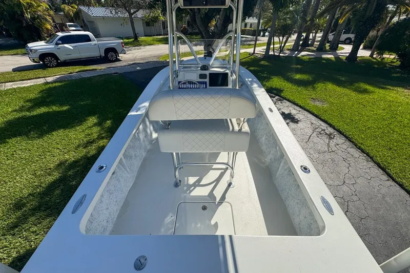 Slide: The Image of 1972 Cuda Craft Open Fisherman boat interior with seating and console, parked on driveway. - 12