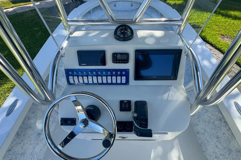 Slide: The Image of 1972 Cuda Craft Open Fisherman boat dashboard with steering wheel and navigation equipment. - 20