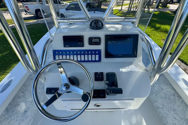 Slide: The Image of 1972 Cuda Craft Open Fisherman boat console with steering wheel and navigation equipment. - 21