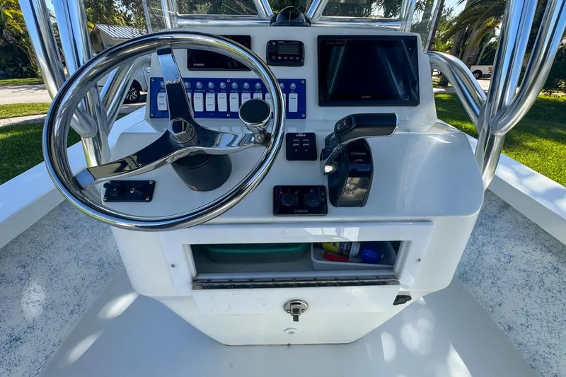 Slide: The Image of 1972 Cuda Craft Open Fisherman boat console with steering wheel and controls. - 24