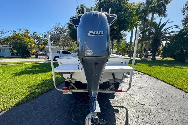 Slide: The Image of 1972 Cuda Craft Open Fisherman boat with Yamaha 200 outboard motor on driveway. - 3