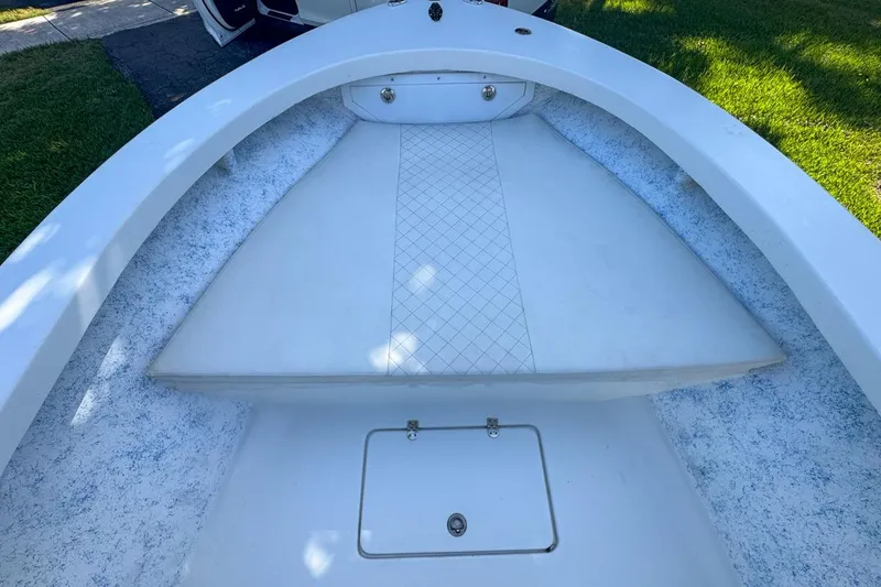 Slide: The Image of 1972 Cuda Craft Open Fisherman boat interior with white seating and storage compartment. - 31