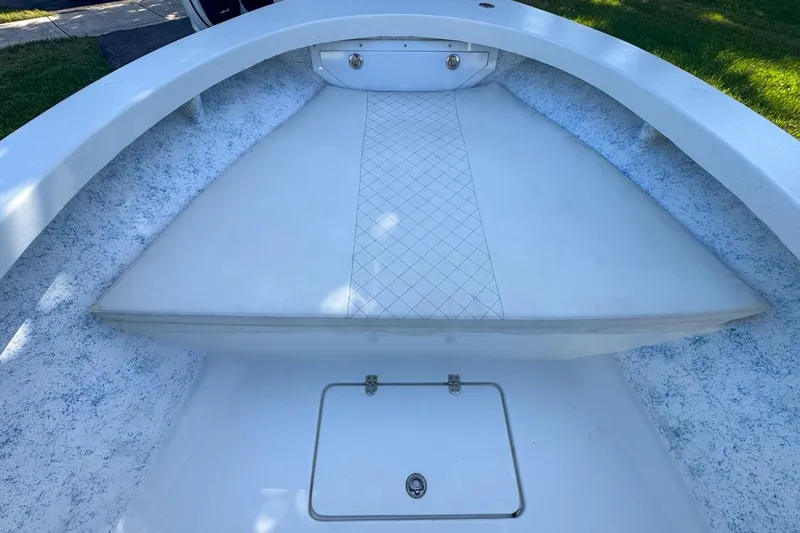 Slide: The Image of 1972 Cuda Craft Open Fisherman boat interior with white seating and storage compartment. - 32