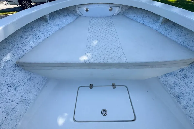 Slide: The Image of 1972 Cuda Craft Open Fisherman boat interior with white seating and storage compartment. - 33