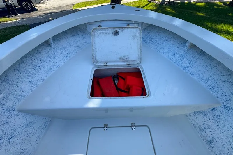 Slide: The Image of 1972 Cuda Craft Open Fisherman boat with open storage compartment and life jackets. - 38