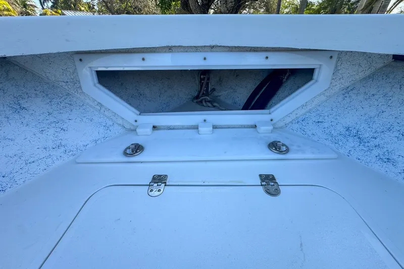 Slide: The Image of 1972 Cuda Craft Open Fisherman boat hatch with white interior and metal hinges. - 41