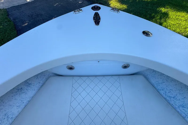 Slide: The Image of 1972 Cuda Craft Open Fisherman boat deck with white seating and diamond pattern. - 43