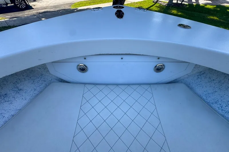 Slide: The Image of 1972 Cuda Craft Open Fisherman boat interior with white seating and storage compartment. - 44