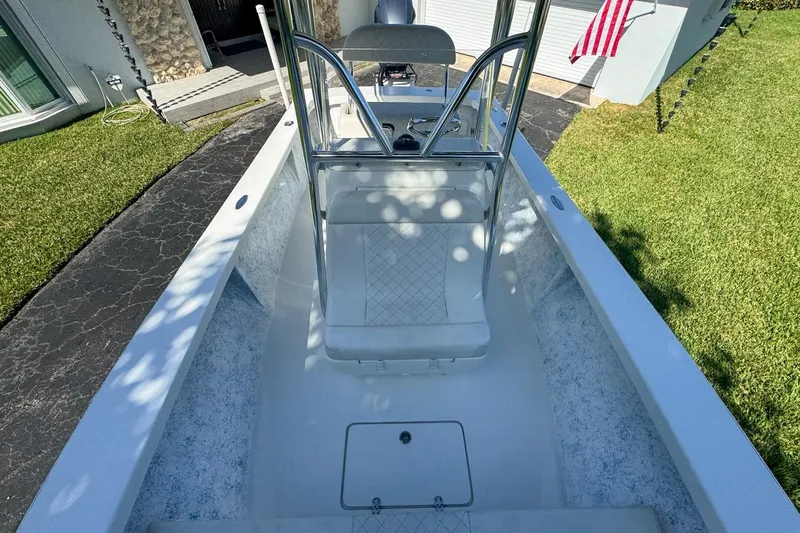 Slide: The Image of 1972 Cuda Craft Open Fisherman boat, clean deck view, parked on driveway. - 48
