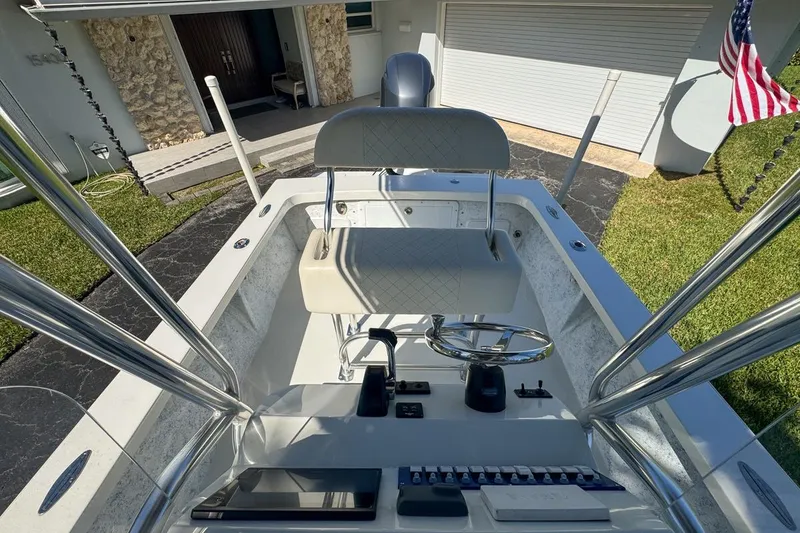 Slide: The Image of 1972 Cuda Craft Open Fisherman boat with steering console and seating, parked in driveway. - 58
