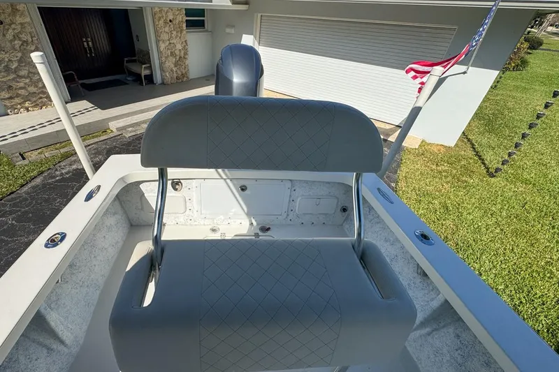 Slide: The Image of 1972 Cuda Craft Open Fisherman boat with cushioned seating and American flag. - 61