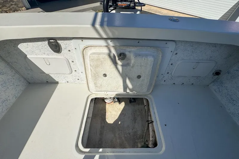 Slide: The Image of 1972 Cuda Craft Open Fisherman boat interior with storage compartments. - 66