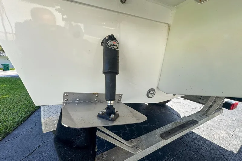 Slide: The Image of 1972 Cuda Craft Open Fisherman boat with Lenco trim tab on trailer. - 75