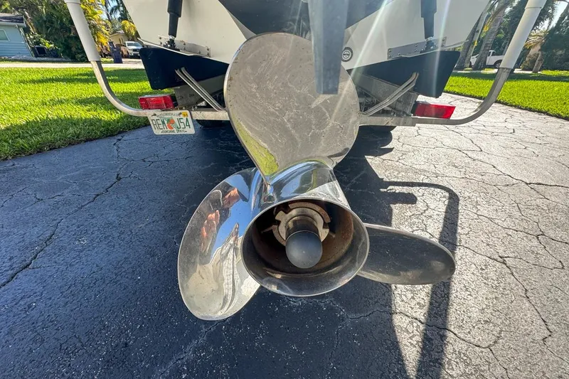 Slide: The Image of Propeller of a 1972 Cuda Craft Open Fisherman boat on a driveway. - 77