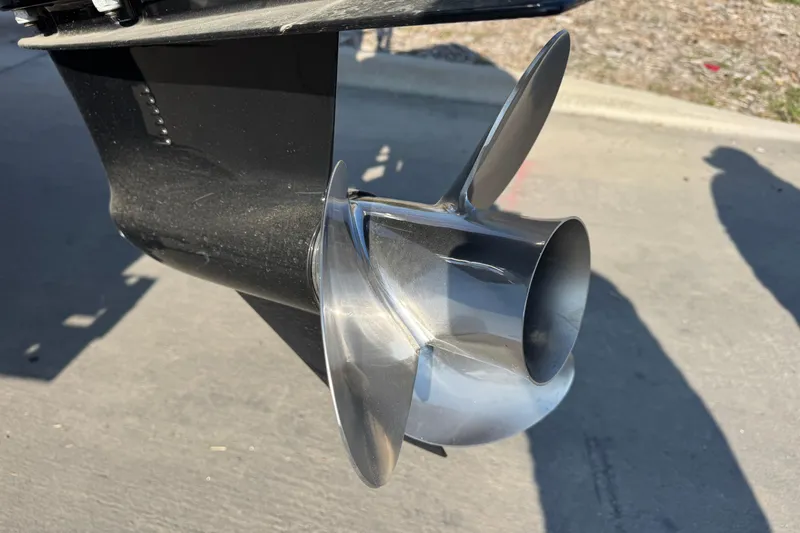 Slide: The Image of Close-up of a 2021 Barletta C22CC boat propeller on a concrete surface. - 10