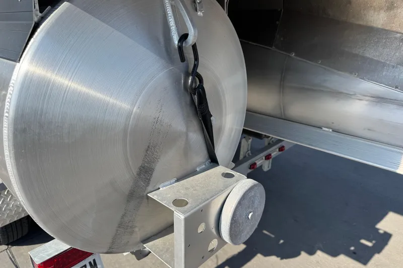 Slide: The Image of 2021 Barletta C22CC pontoon boat trailer detail with metal components. - 11