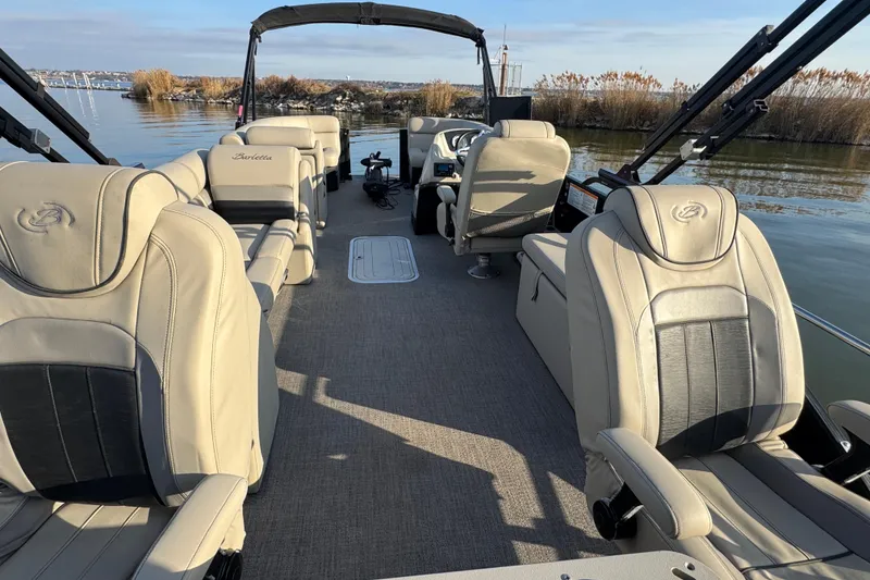 Slide: The Image of 2021 Barletta C22CC pontoon boat interior with luxurious seating and scenic water view. - 36