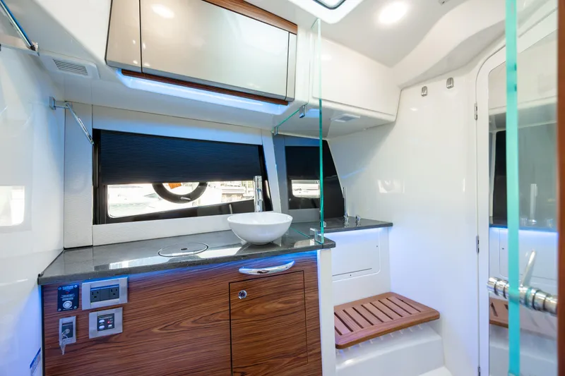 Slide: The Image of Luxurious interior of 2021 Boston Whaler 405 Conquest yacht with modern kitchen and wooden finishes. - 20