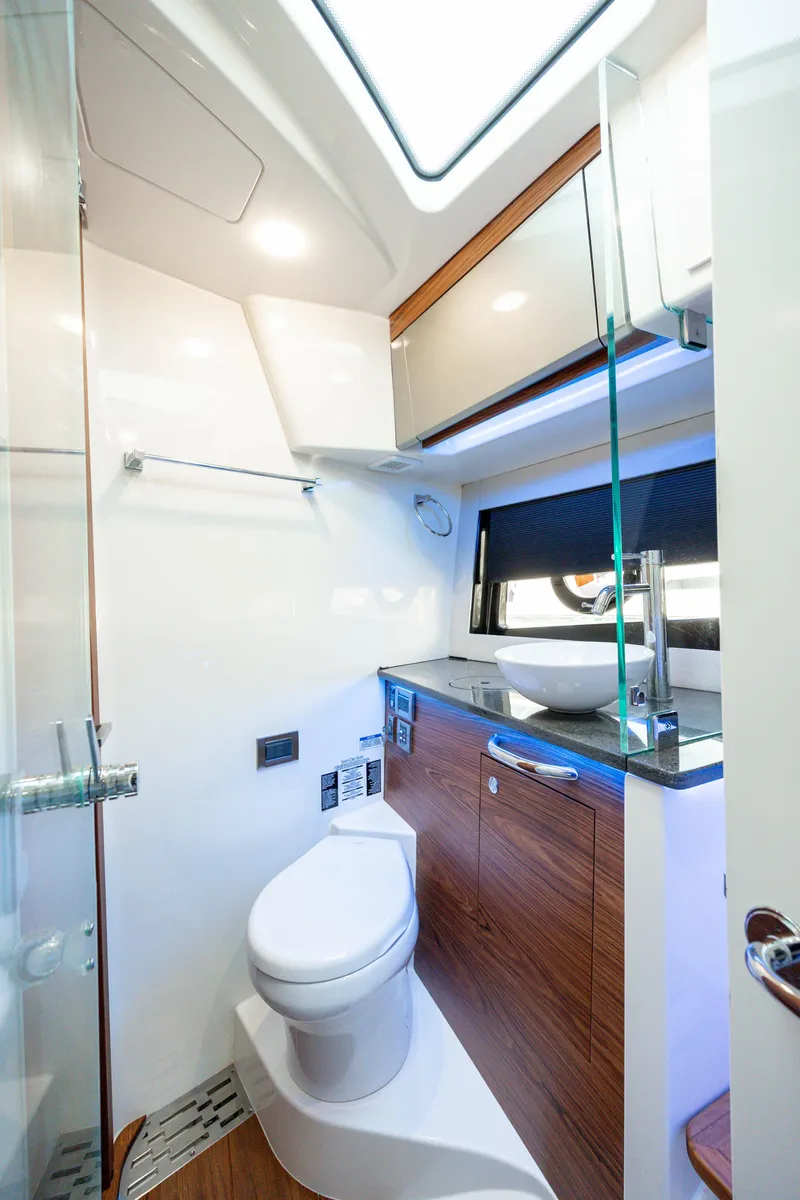 Slide: The Image of Luxurious interior of 2021 Boston Whaler 405 Conquest yacht, featuring modern kitchen and bathroom. - 23